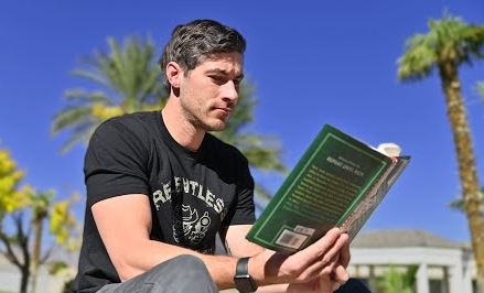 visualisation of a man reading a blackjack book